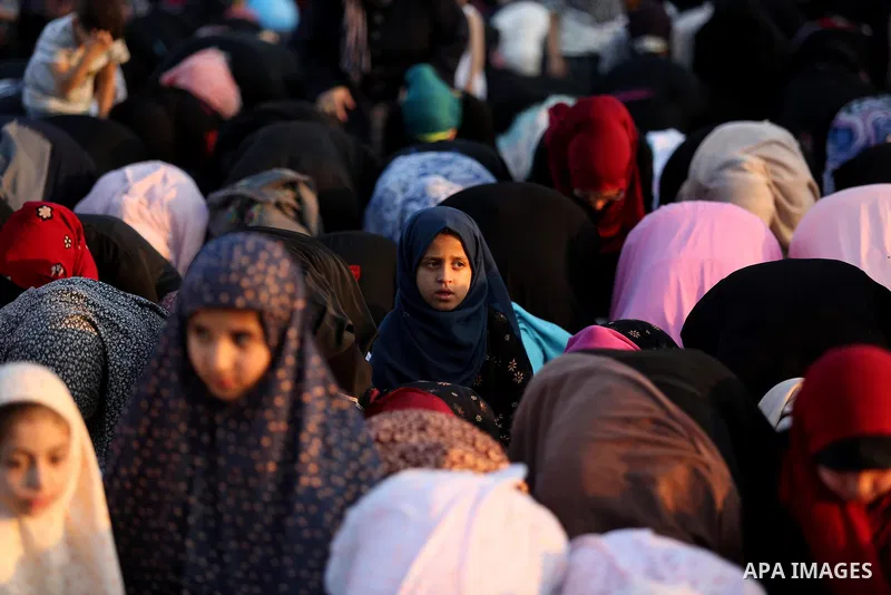 Palestinian Muslim women perform Eid al-Fitr prayers in Gaza City June 25, 2017. Eid al-Fitr marks the end of Muslim's holy fasting month of Ramadan when faithfuls abstain from eating, drinking, smoking and sexual activi...