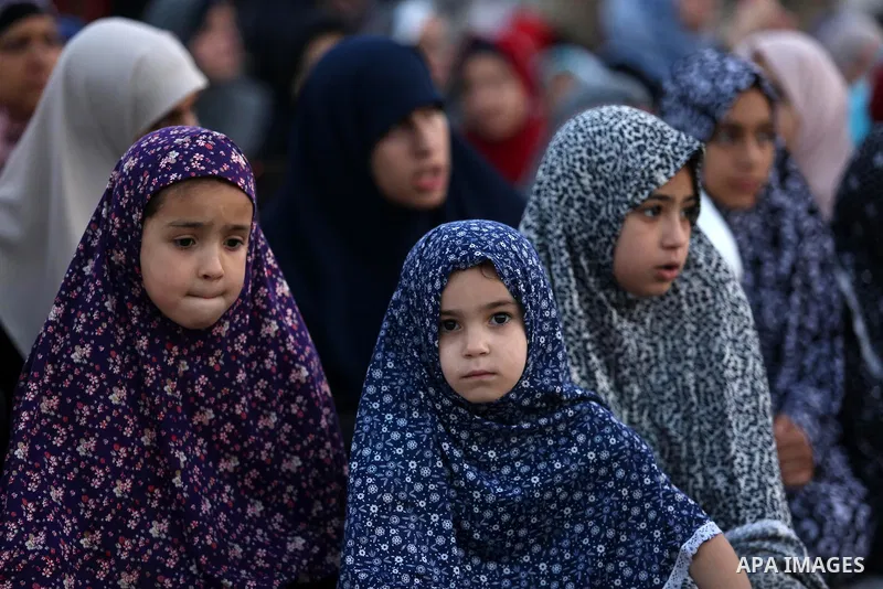 Palestinian Muslim women perform Eid al-Fitr prayers in Gaza City June 25, 2017. Eid al-Fitr marks the end of Muslim's holy fasting month of Ramadan when faithfuls abstain from eating, drinking, smoking and sexual activi...