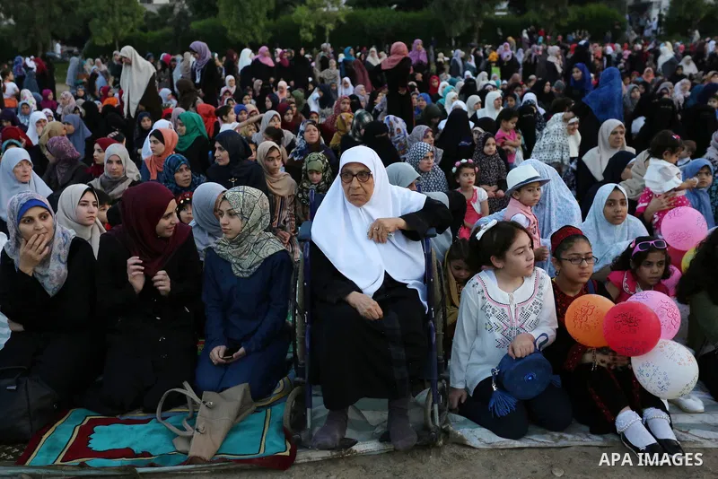 Palestinian Muslim women perform Eid al-Fitr prayers in Gaza City June 25, 2017. Eid al-Fitr marks the end of Muslim's holy fasting month of Ramadan when faithfuls abstain from eating, drinking, smoking and sexual activi...