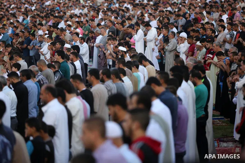 Palestinian Muslims perform Eid al-Fitr prayers in Gaza City June 25, 2017. Eid al-Fitr marks the end of Muslim's holy fasting month of Ramadan when faithfuls abstain from eating, drinking, smoking and sexual activities...