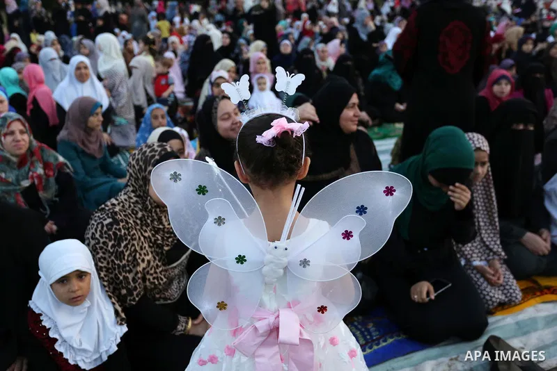Palestinian Muslim women perform Eid al-Fitr prayers in Gaza City June 25, 2017. Eid al-Fitr marks the end of Muslim's holy fasting month of Ramadan when faithfuls abstain from eating, drinking, smoking and sexual activi...