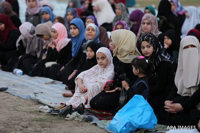 Palestinian Muslim women perform Eid al-Fitr prayers in Gaza City June 25, 2017. Eid al-Fitr marks the end of Muslim's holy fasting month of Ramadan when faithfuls abstain from eating, drinking, smoking and sexual activi...