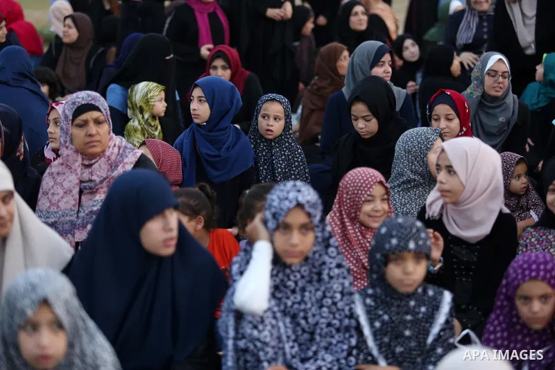 Palestinian Muslim women perform Eid al-Fitr prayers in Gaza City June 25, 2017. Eid al-Fitr marks the end of Muslim's holy fasting month of Ramadan when faithfuls abstain from eating, drinking, smoking and sexual activi...