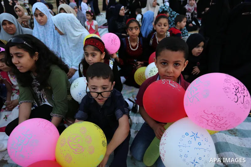 Palestinian children attend Eid al-Fitr prayers in Gaza City June 25, 2017. Eid al-Fitr marks the end of Muslim's holy fasting month of Ramadan when faithfuls abstain from eating, drinking, smoking and sexual activities...