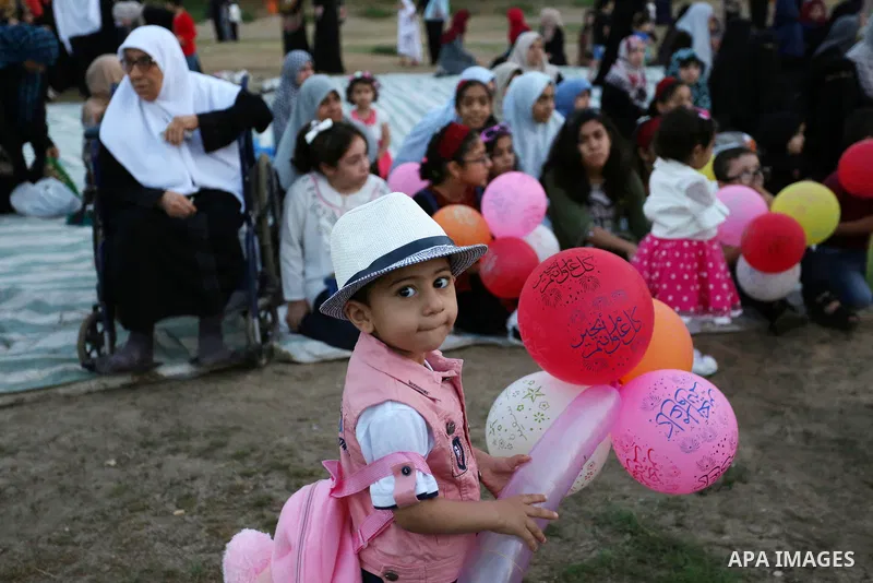Palestinian children attend Eid al-Fitr prayers in Gaza City June 25, 2017. Eid al-Fitr marks the end of Muslim's holy fasting month of Ramadan when faithfuls abstain from eating, drinking, smoking and sexual activities...