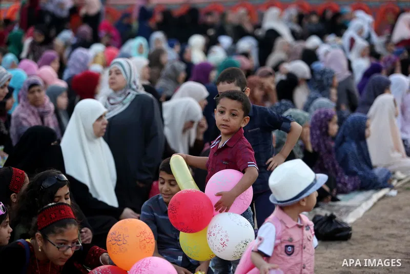 Palestinian Muslim women perform Eid al-Fitr prayers in Gaza City June 25, 2017. Eid al-Fitr marks the end of Muslim's holy fasting month of Ramadan when faithfuls abstain from eating, drinking, smoking and sexual activi...