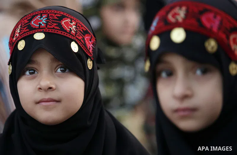 Palestinian Muslim girls attend Eid al-Fitr prayers in Gaza City June 25, 2017. Eid al-Fitr marks the end of Muslim's holy fasting month of Ramadan when faithfuls abstain from eating, drinking, smoking and sexual activit...