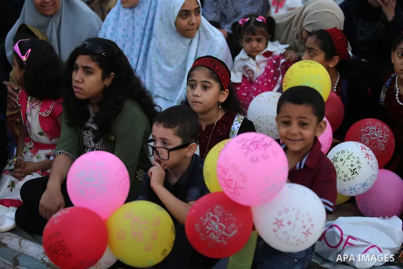 Palestinian children attend Eid al-Fitr prayers in Gaza City June 25, 2017. Eid al-Fitr marks the end of Muslim's holy fasting month of Ramadan when faithfuls abstain from eating, drinking, smoking and sexual activities...