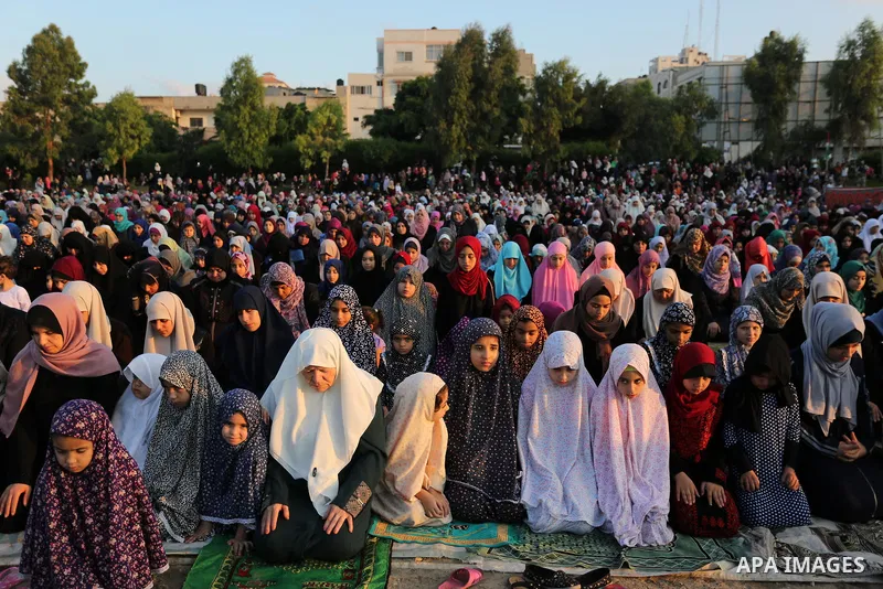 Palestinian Muslim women perform Eid al-Fitr prayers in Gaza City June 25, 2017. Eid al-Fitr marks the end of Muslim's holy fasting month of Ramadan when faithfuls abstain from eating, drinking, smoking and sexual activi...