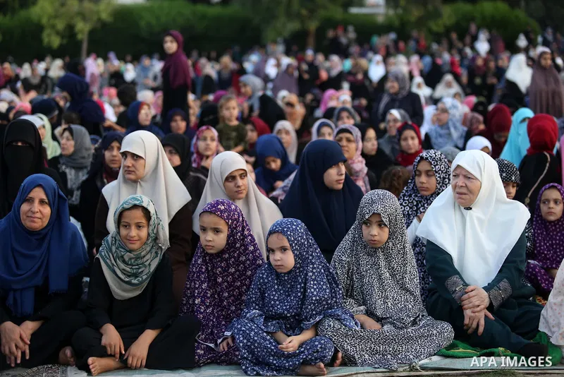 Palestinian Muslim women perform Eid al-Fitr prayers in Gaza City June 25, 2017. Eid al-Fitr marks the end of Muslim's holy fasting month of Ramadan when faithfuls abstain from eating, drinking, smoking and sexual activi...