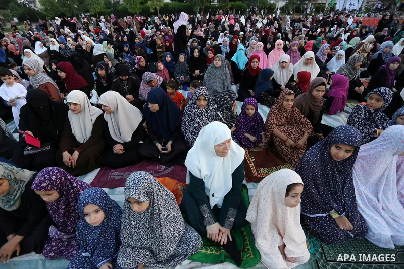 Palestinian Muslim women perform Eid al-Fitr prayers in Gaza City June 25, 2017. Eid al-Fitr marks the end of Muslim's holy fasting month of Ramadan when faithfuls abstain from eating, drinking, smoking and sexual activi...