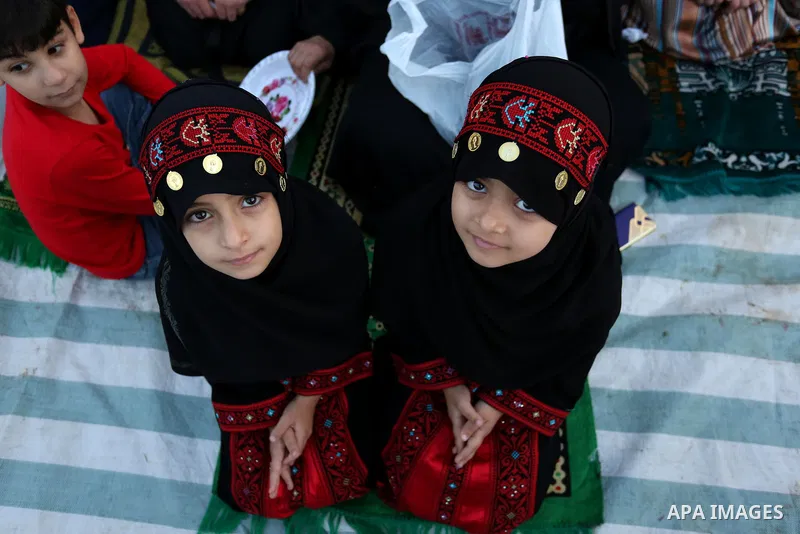 Palestinian Muslim girls attend Eid al-Fitr prayers in Gaza City June 25, 2017. Eid al-Fitr marks the end of Muslim's holy fasting month of Ramadan when faithfuls abstain from eating, drinking, smoking and sexual activit...
