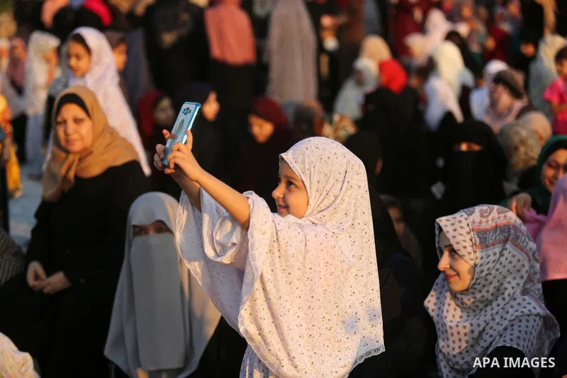 Palestinian Muslim women perform Eid al-Fitr prayers in Gaza City June 25, 2017. Eid al-Fitr marks the end of Muslim's holy fasting month of Ramadan when faithfuls abstain from eating, drinking, smoking and sexual activi...