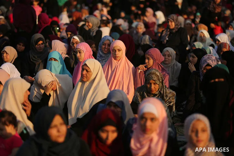 Palestinian Muslim women perform Eid al-Fitr prayers in Gaza City June 25, 2017. Eid al-Fitr marks the end of Muslim's holy fasting month of Ramadan when faithfuls abstain from eating, drinking, smoking and sexual activi...