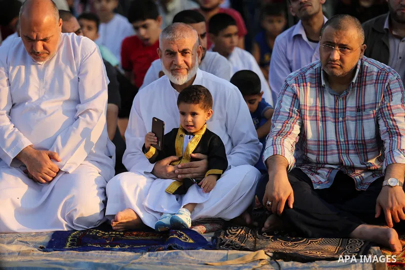 Palestinian Muslims perform Eid al-Fitr prayers in Gaza City June 25, 2017. Eid al-Fitr marks the end of Muslim's holy fasting month of Ramadan when faithfuls abstain from eating, drinking, smoking and sexual activities...
