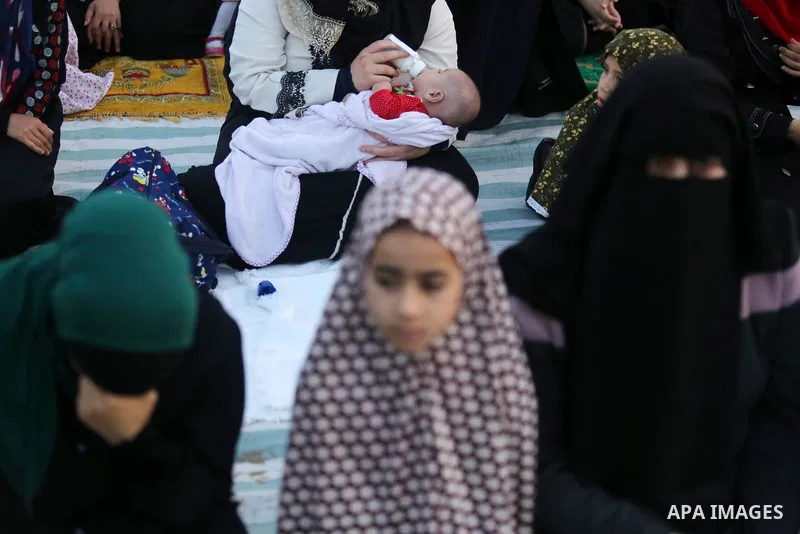 Palestinian Muslim women perform Eid al-Fitr prayers in Gaza City June 25, 2017. Eid al-Fitr marks the end of Muslim's holy fasting month of Ramadan when faithfuls abstain from eating, drinking, smoking and sexual activi...