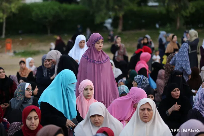 Palestinian Muslim women perform Eid al-Fitr prayers in Gaza City June 25, 2017. Eid al-Fitr marks the end of Muslim's holy fasting month of Ramadan when faithfuls abstain from eating, drinking, smoking and sexual activi...