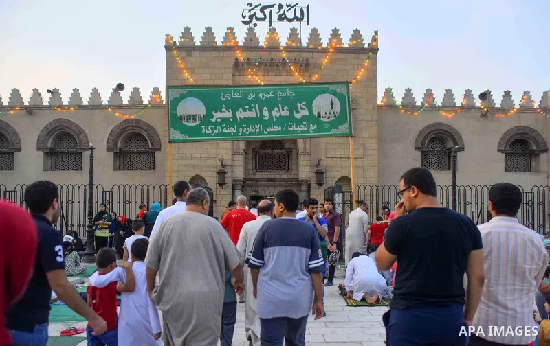 Egyptians attend the morning prayers for Eid al-Fitr celebrations, which marks the end of the holy fasting month of Ramadan, in Cairo, Egypt, on June 25, 2017. Photo by Amr Sayed