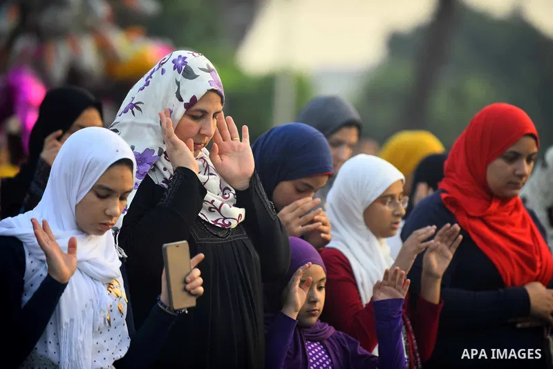 Egyptians attend the morning prayers for Eid al-Fitr celebrations, which marks the end of the holy fasting month of Ramadan, in Cairo, Egypt, on June 25, 2017. Photo by Amr Sayed