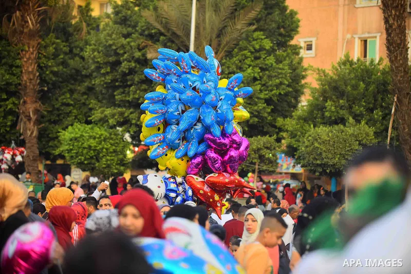 Egyptians attend the morning prayers for Eid al-Fitr celebrations, which marks the end of the holy fasting month of Ramadan, in Cairo, Egypt, on June 25, 2017. Photo by Amr Sayed
