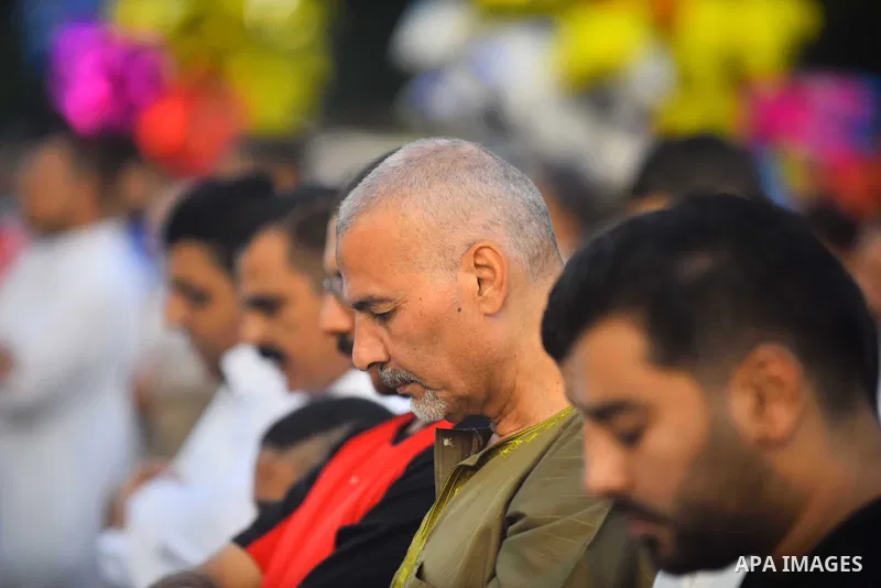 Egyptians attend the morning prayers for Eid al-Fitr celebrations, which marks the end of the holy fasting month of Ramadan, in Cairo, Egypt, on June 25, 2017. Photo by Amr Sayed