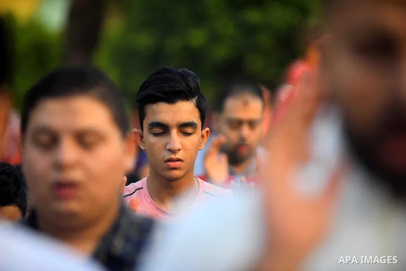 Egyptians attend the morning prayers for Eid al-Fitr celebrations, which marks the end of the holy fasting month of Ramadan, in Cairo, Egypt, on June 25, 2017. Photo by Amr Sayed