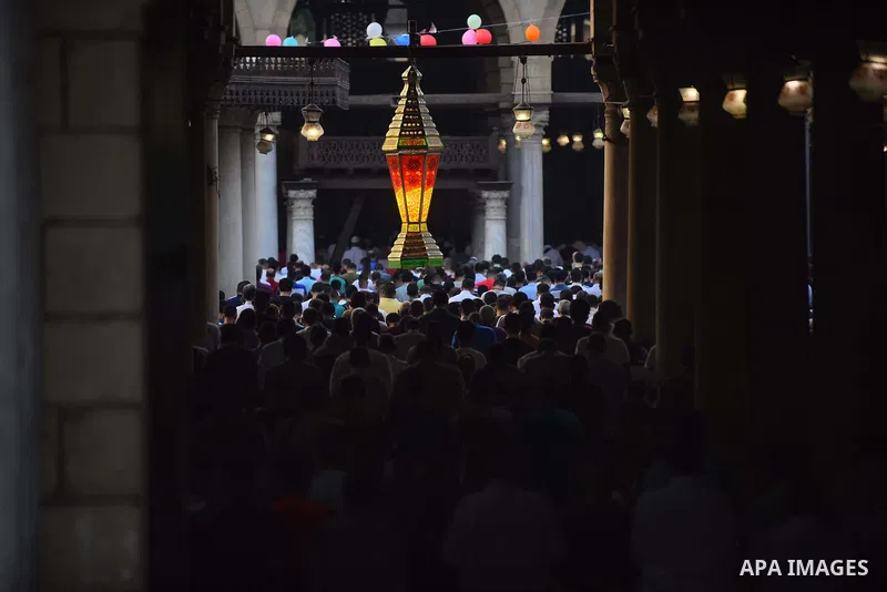 Egyptians attend the morning prayers for Eid al-Fitr celebrations, which marks the end of the holy fasting month of Ramadan, in Cairo, Egypt, on June 25, 2017. Photo by Amr Sayed