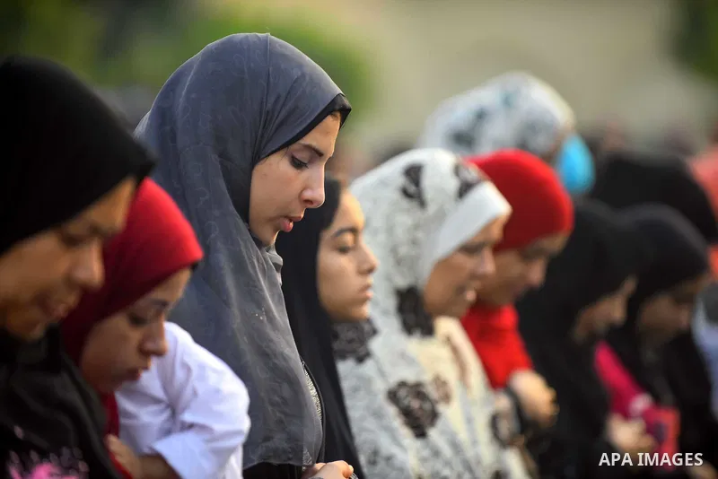 Egyptians attend the morning prayers for Eid al-Fitr celebrations, which marks the end of the holy fasting month of Ramadan, in Cairo, Egypt, on June 25, 2017. Photo by Amr Sayed