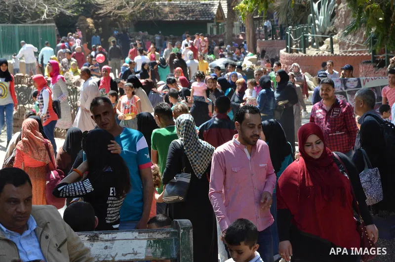 Egyptians celebrate at a park, in Cairo June 25, 2017, on the first day of Eid al-Fitr holiday which marks the end of the Muslim holy month of Ramadan. Photo by Amr Sayed