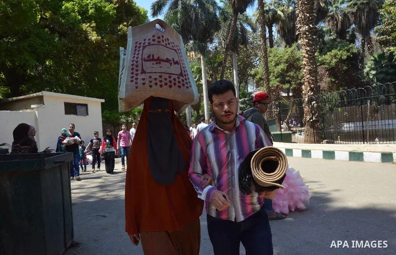 Egyptians celebrate at a park, in Cairo June 25, 2017, on the first day of Eid al-Fitr holiday which marks the end of the Muslim holy month of Ramadan. Photo by Amr Sayed