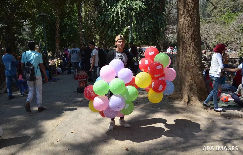 Egyptians celebrate at a park, in Cairo June 25, 2017, on the first day of Eid al-Fitr holiday which marks the end of the Muslim holy month of Ramadan. Photo by Amr Sayed
