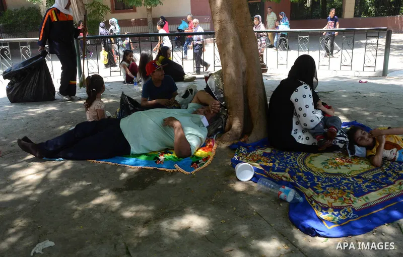 Egyptians celebrate at a park, in Cairo June 25, 2017, on the first day of Eid al-Fitr holiday which marks the end of the Muslim holy month of Ramadan. Photo by Amr Sayed