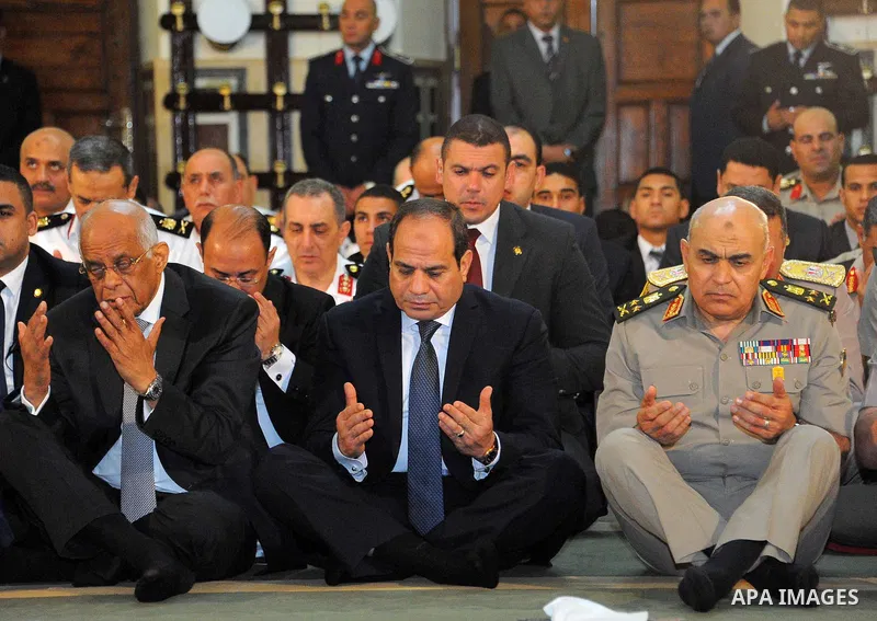 Egyptian President Abdel Fattah al-Sisi performs the morning prayer of Eid al-Fitr holiday which marks the end of the Muslim holy month of Ramadan, in Cairo, Egypt, on June 25, 2017. Photo by Egyptian President Office