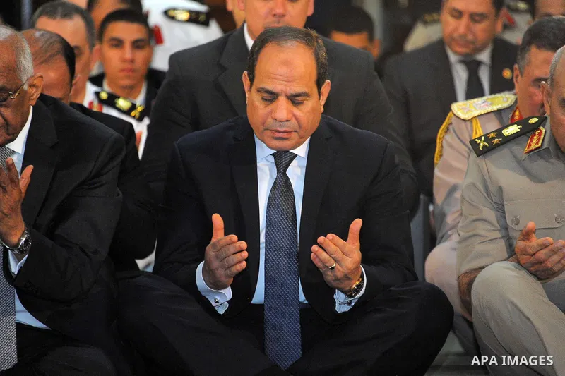 Egyptian President Abdel Fattah al-Sisi performs the morning prayer of Eid al-Fitr holiday which marks the end of the Muslim holy month of Ramadan, in Cairo, Egypt, on June 25, 2017. Photo by Egyptian President Office