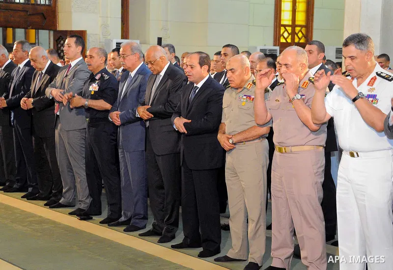 Egyptian President Abdel Fattah al-Sisi performs the morning prayer of Eid al-Fitr holiday which marks the end of the Muslim holy month of Ramadan, in Cairo, Egypt, on June 25, 2017. Photo by Egyptian President Office