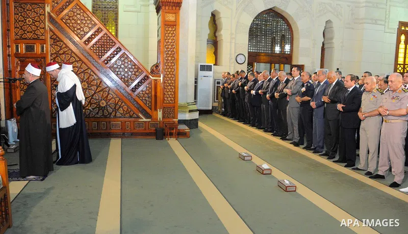 Egyptian President Abdel Fattah al-Sisi performs the morning prayer of Eid al-Fitr holiday which marks the end of the Muslim holy month of Ramadan, in Cairo, Egypt, on June 25, 2017. Photo by Egyptian President Office