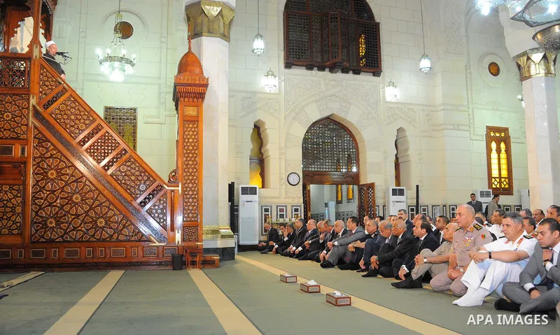 Egyptian President Abdel Fattah al-Sisi performs the morning prayer of Eid al-Fitr holiday which marks the end of the Muslim holy month of Ramadan, in Cairo, Egypt, on June 25, 2017. Photo by Egyptian President Office