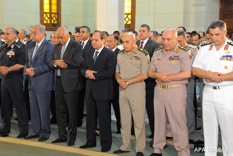 Egyptian President Abdel Fattah al-Sisi performs the morning prayer of Eid al-Fitr holiday which marks the end of the Muslim holy month of Ramadan, in Cairo, Egypt, on June 25, 2017. Photo by Egyptian President Office