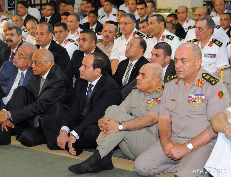 Egyptian President Abdel Fattah al-Sisi performs the morning prayer of Eid al-Fitr holiday which marks the end of the Muslim holy month of Ramadan, in Cairo, Egypt, on June 25, 2017. Photo by Egyptian President Office