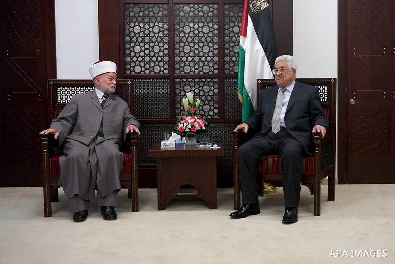 Palestinian President Mahmoud Abbas meets with the Mufti of Jerusalem, Sheikh Mohammed Hussein, in the West Bank city of Ramallah on June 26, 2017. Photo by Osama Falah