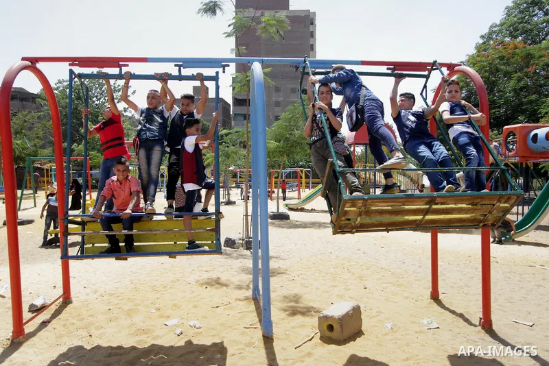 Egyptians celebrate at a park, in Cairo June 26, 2017, on the second day of Eid al-Fitr holiday which marks the end of the Muslim holy month of Ramadan. Photo by Amr Sayed