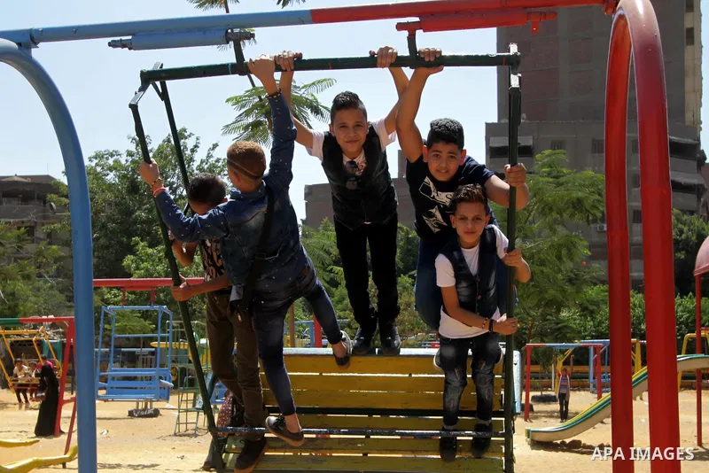 Egyptians celebrate at a park, in Cairo June 26, 2017, on the second day of Eid al-Fitr holiday which marks the end of the Muslim holy month of Ramadan. Photo by Amr Sayed