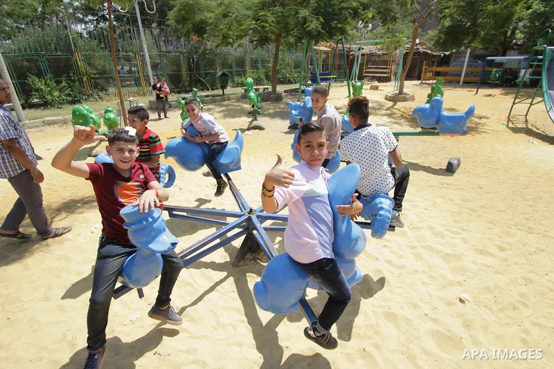 Egyptians celebrate at a park, in Cairo June 26, 2017, on the second day of Eid al-Fitr holiday which marks the end of the Muslim holy month of Ramadan. Photo by Amr Sayed