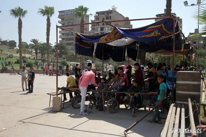 Egyptians celebrate at a park, in Cairo June 26, 2017, on the second day of Eid al-Fitr holiday which marks the end of the Muslim holy month of Ramadan. Photo by Amr Sayed
