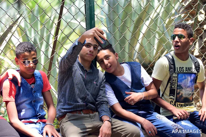 Egyptians enjoy at a zoo on the second day of of Eid al-Fitr holiday which marks the end of the Muslim holy month of Ramadan, in Cairo June 26, 2017. Photo by Amr Sayed