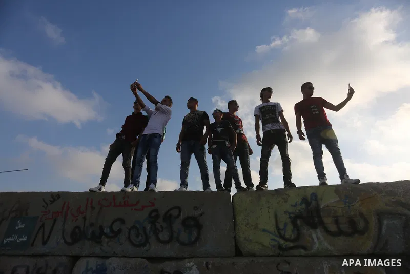 Palestinians celebrate on the second day of Eid al-Fitr holiday which marks the end of the Muslim holy month of Ramadan at the seaport of Gaza city June 26, 2017. Photo by Mohammed Asad