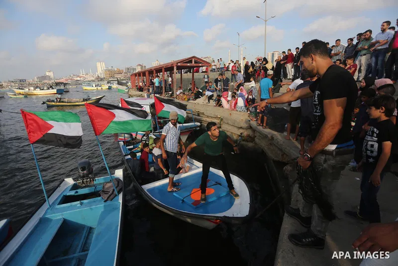 Palestinians celebrate on the second day of Eid al-Fitr holiday which marks the end of the Muslim holy month of Ramadan at the seaport of Gaza city June 26, 2017. Photo by Mohammed Asad