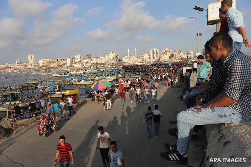 Palestinians celebrate on the second day of Eid al-Fitr holiday which marks the end of the Muslim holy month of Ramadan at the seaport of Gaza city June 26, 2017. Photo by Mohammed Asad
