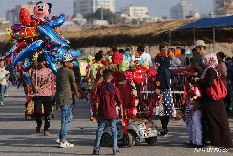 Palestinians celebrate on the second day of Eid al-Fitr holiday which marks the end of the Muslim holy month of Ramadan at the seaport of Gaza city June 26, 2017. Photo by Mohammed Asad