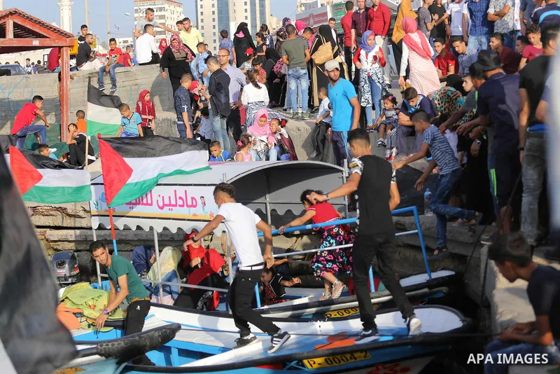 Palestinians celebrate on the second day of Eid al-Fitr holiday which marks the end of the Muslim holy month of Ramadan at the seaport of Gaza city June 26, 2017. Photo by Mohammed Asad